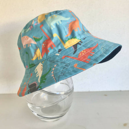 Summer hat in bright dinosaur fabric