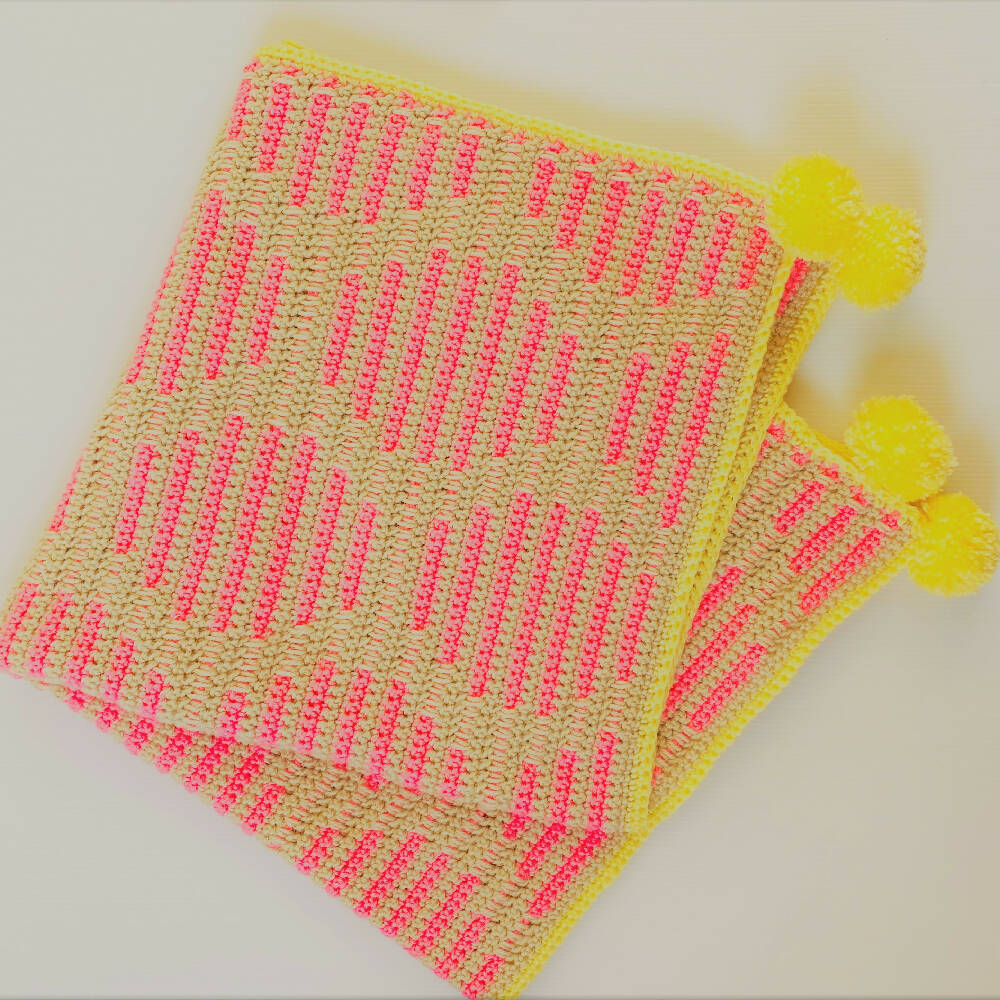 Baby hand made neon pink dot blanket trimmed in bright lemon with pompoms.