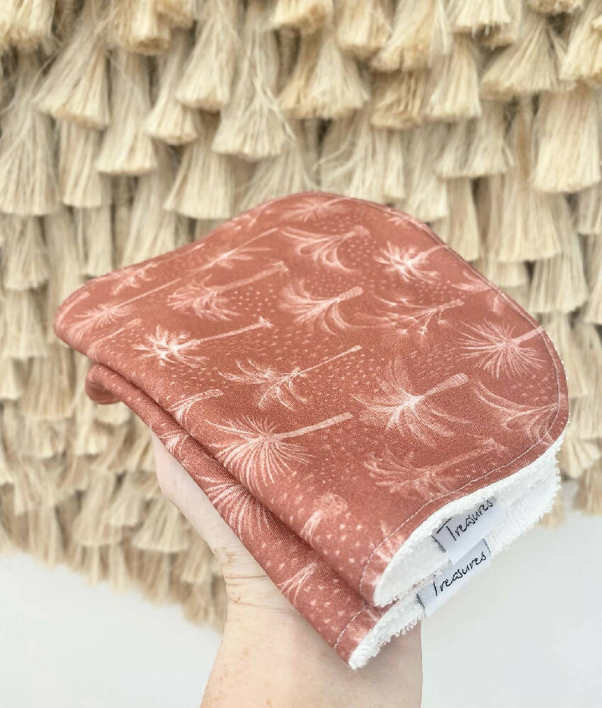 Palms in rust bib