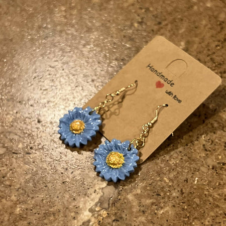 Blue daisy dangle earrings