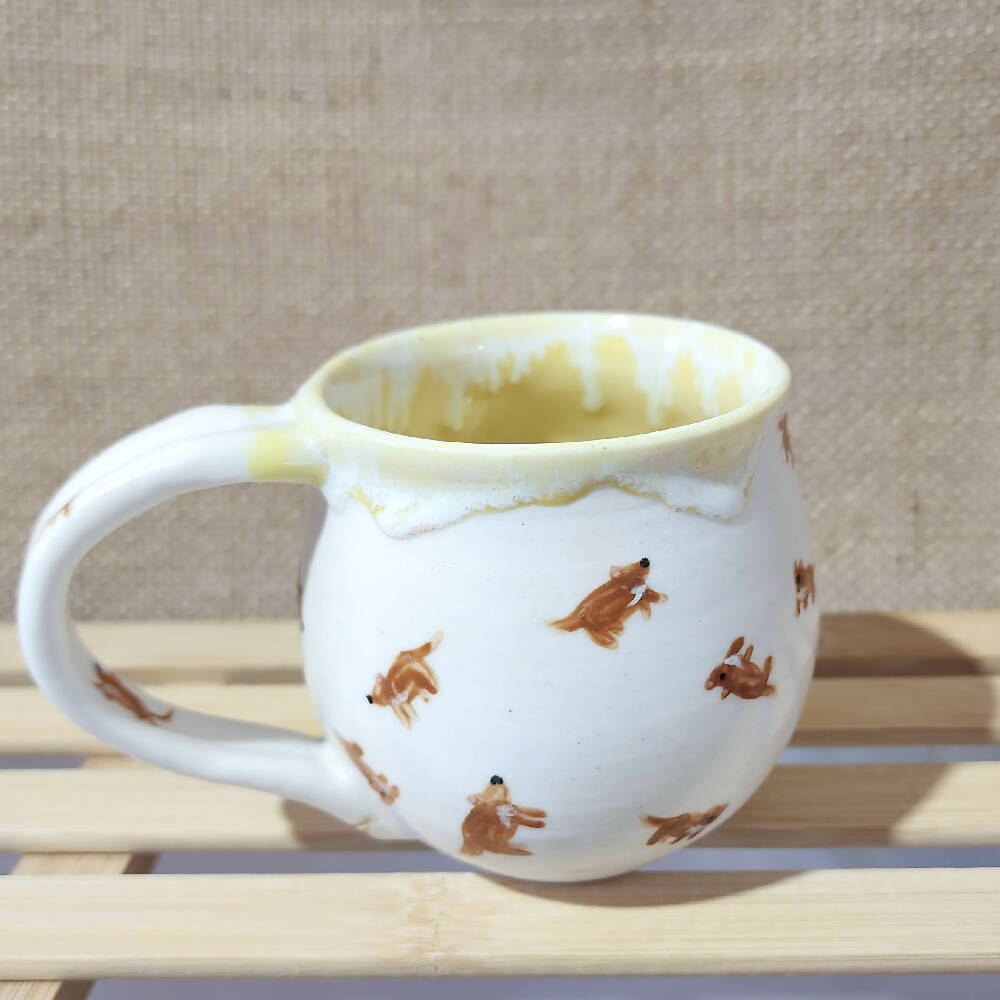 lemon yellow glazed porcelain tassie devil doodle mug, handmade in tassie