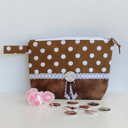 Brown and white zippered pouch.