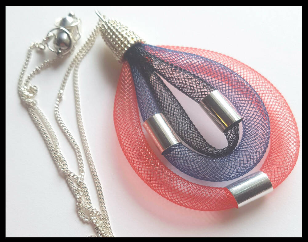 Pendant necklace. Nylon mesh with silver beads and chain.