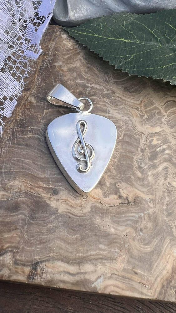 Silver Guitar Plectrum Holder Pendant.