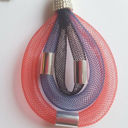 Pendant necklace. Nylon mesh with silver beads and chain.