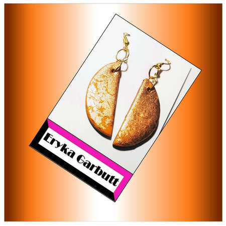 Dangle earrings. Orange and black polymer clay with gold leaf.