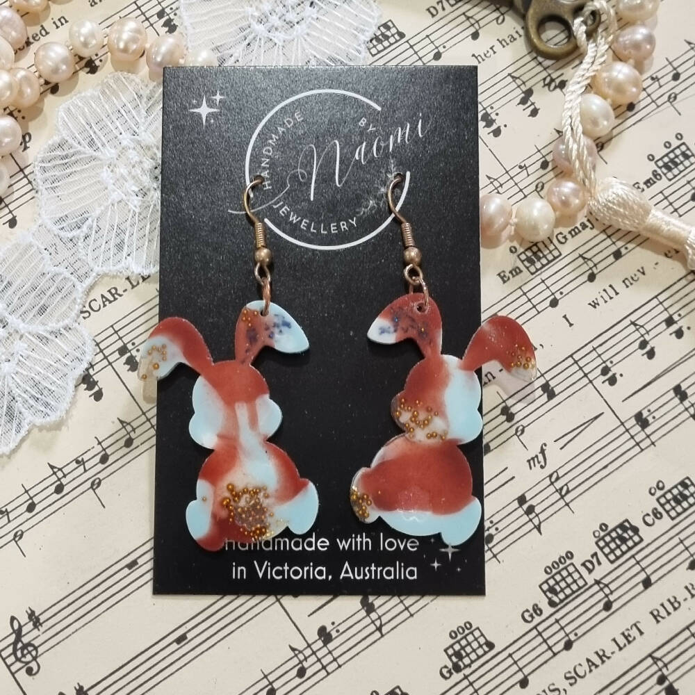 Red, blue and gold resin rabbit dangle earrings
