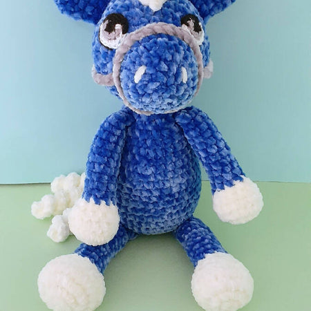A beautifully soft, blue velvet crocheted pony