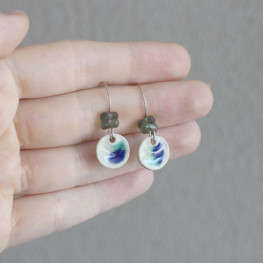 Ceramic silver dangle earrings with blue glass beads