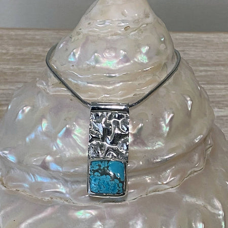 Turquoise and reticulated silver pendant