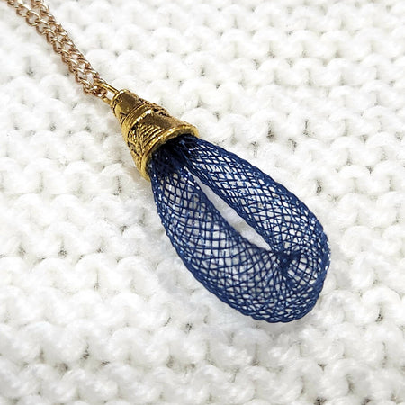 pendant necklace, blue nylon mesh with gold chain
