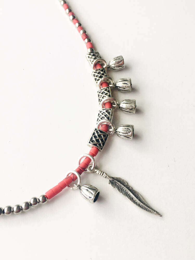 Red boho style feather necklace with red and silver beads