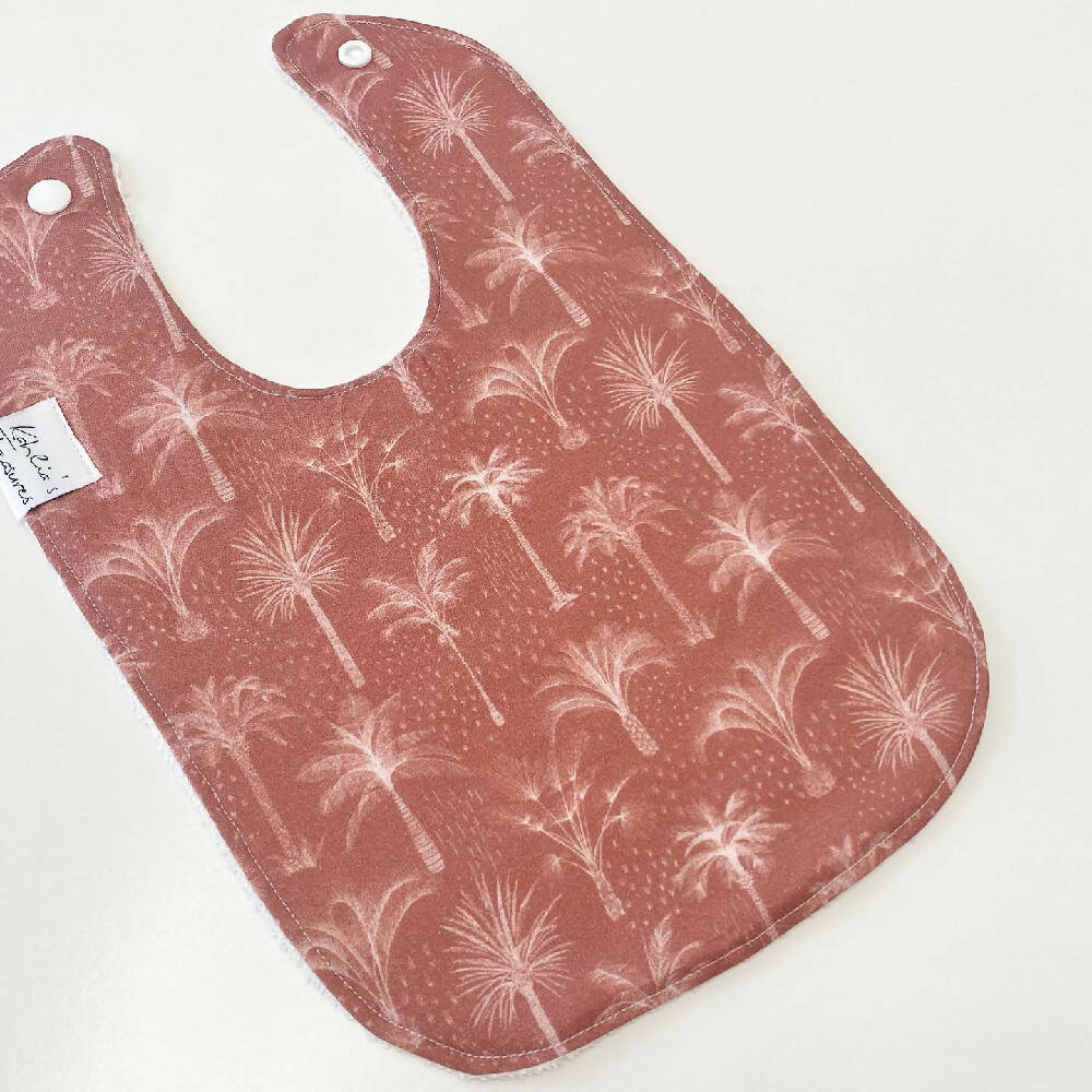 Palms in rust bib