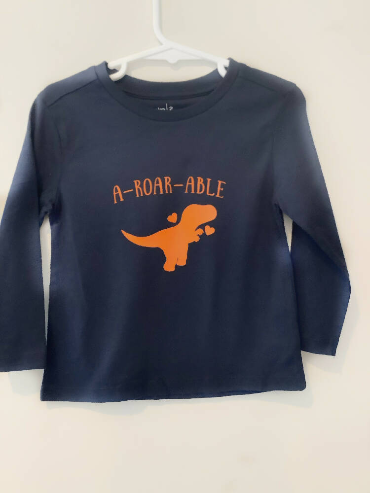Dinosaur graphic T shirt, quote T shirt (a-roar-able), blue T shirt, boys T shirt, long sleeve, crew neck, Australian size 2