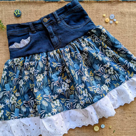 Size 12 Girls denim skirt with flannel flowers