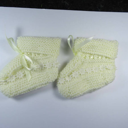 Lemon Bootees with lace trim.