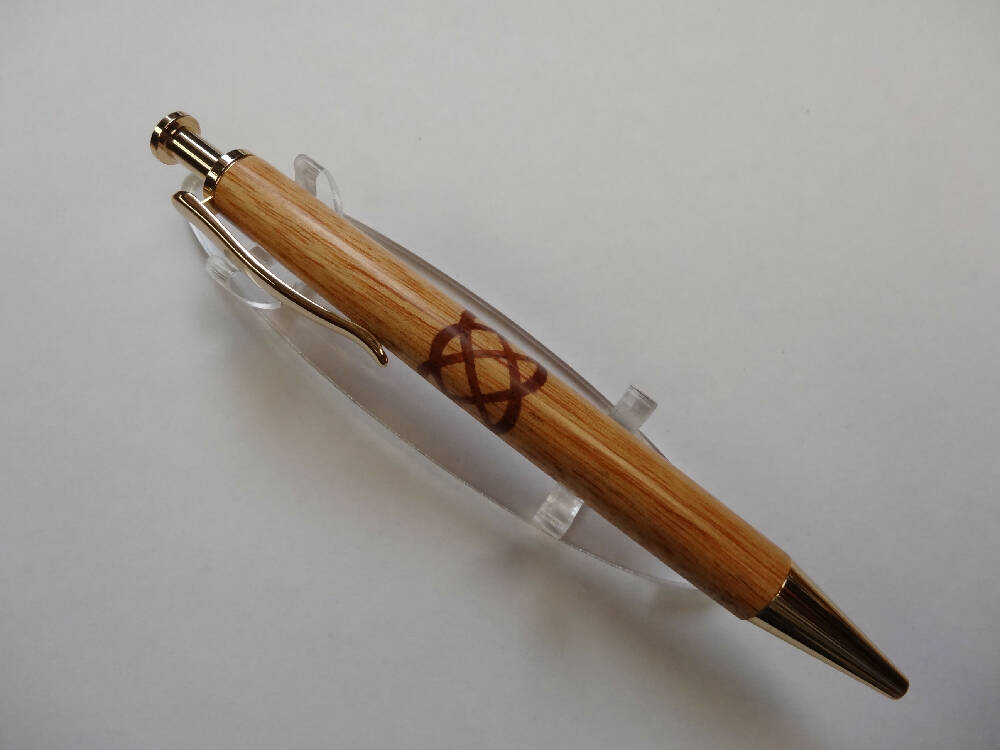 Pacific Maple Click pen with a Red Gum insert Celtic knot