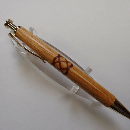 Pacific Maple Click pen with a Red Gum insert Celtic knot