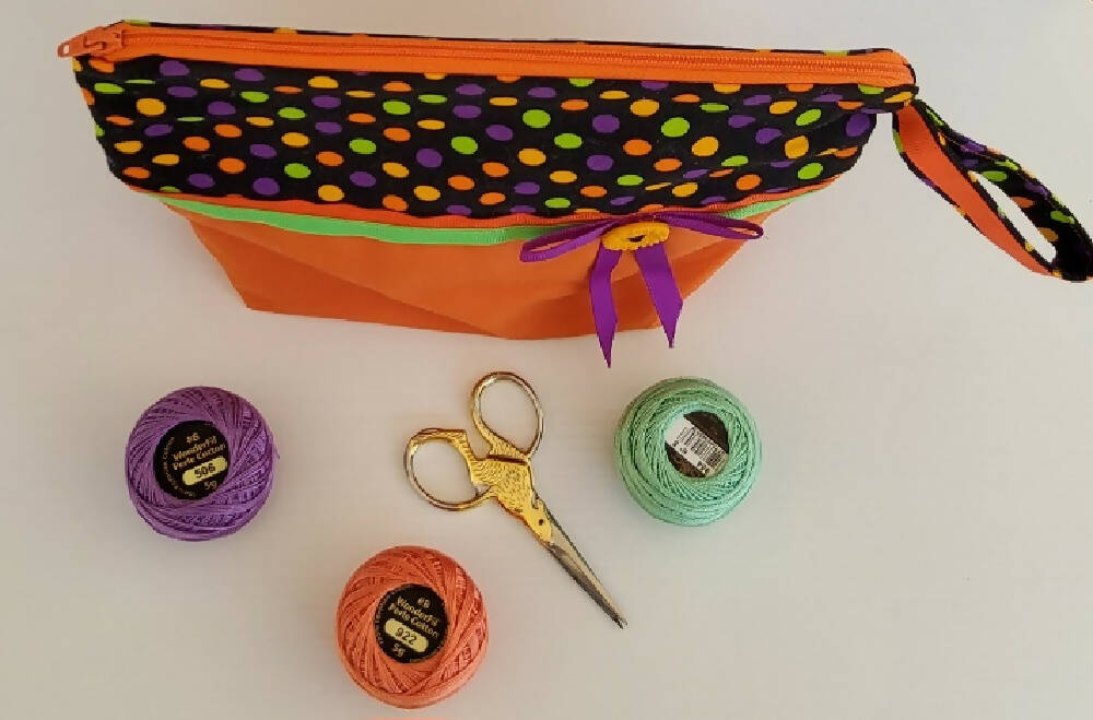 Orange, purple and lime zippered pouch.