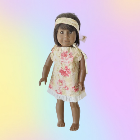 Dolls clothes an American Girl pillowcase dress and headband.