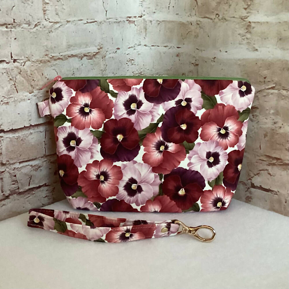 Pink Floral Pansies clutch purse with detachable wristlet. (Approx. 24cm x 17cm - 5cm gusset)