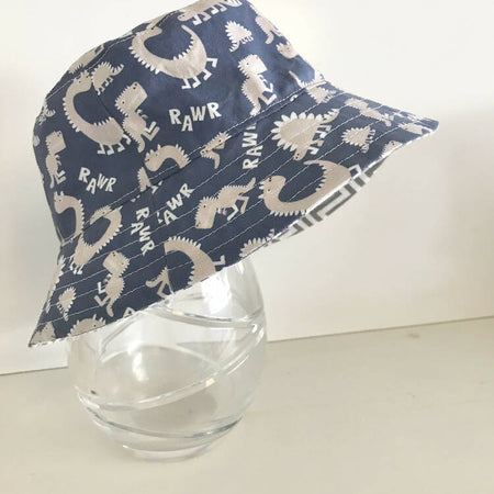 Summer hat in blue and grey dinosaur fabric