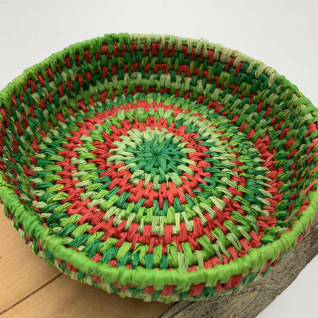 Basket in shades of green and red raffia