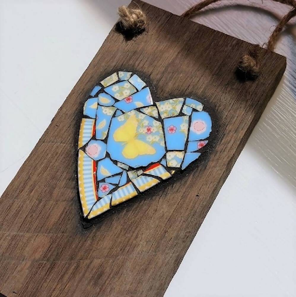 Broken china mosaic heart wall hanging, yellow butterfly mosaic on old timber