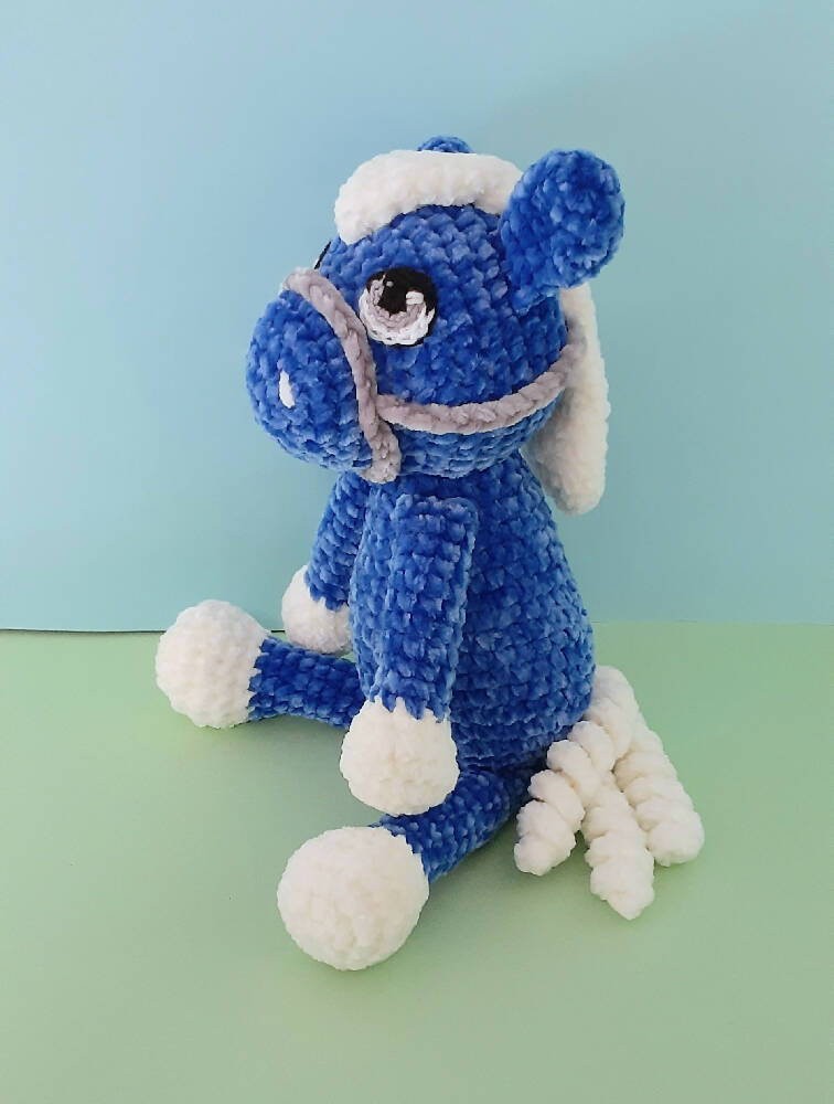 A beautifully soft, blue velvet crocheted pony