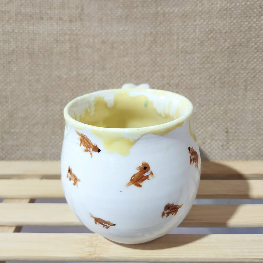 lemon yellow glazed porcelain tassie devil doodle mug, handmade in tassie