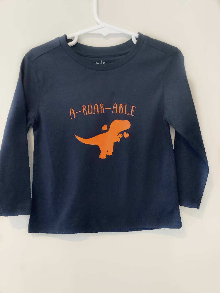 Dinosaur graphic T shirt, quote T shirt (a-roar-able), blue T shirt, boys T shirt, long sleeve, crew neck, Australian size 2