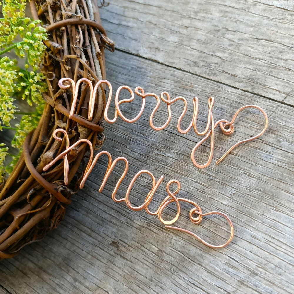 christmas handmade merry xmas earrings on wreath with greenery