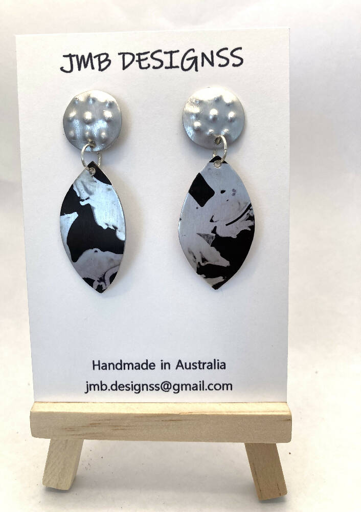 Printed black anodised aluminium earrings with raised dots studs