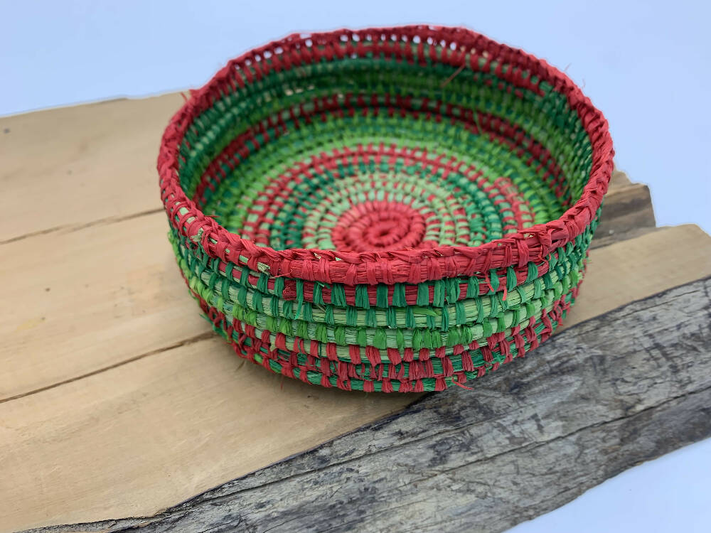 Raffia basket in shades of green and red