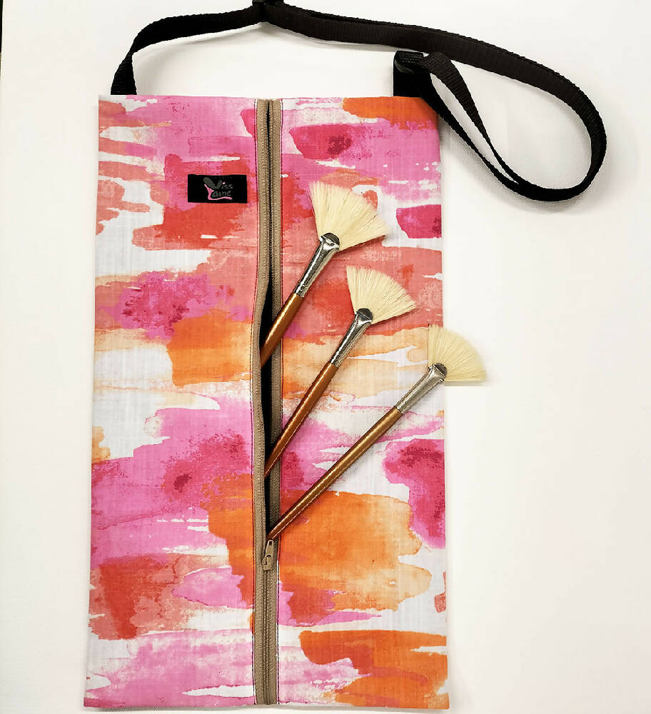 Accessory  bag with adjustable strap. Pink and orange