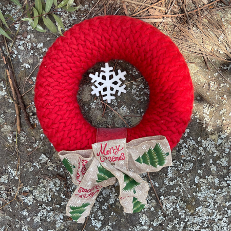 Handknitted Christmas Wreath. Glorious red with ceramic snowflake