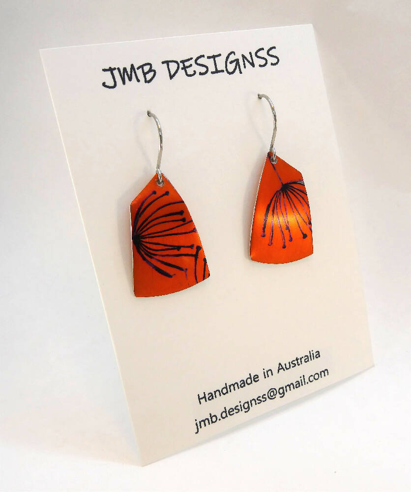 Printed and dyed orange and black anodised aluminium earrings