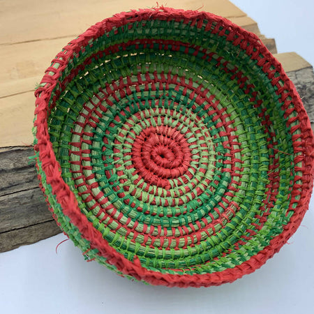 Raffia basket in shades of green and red