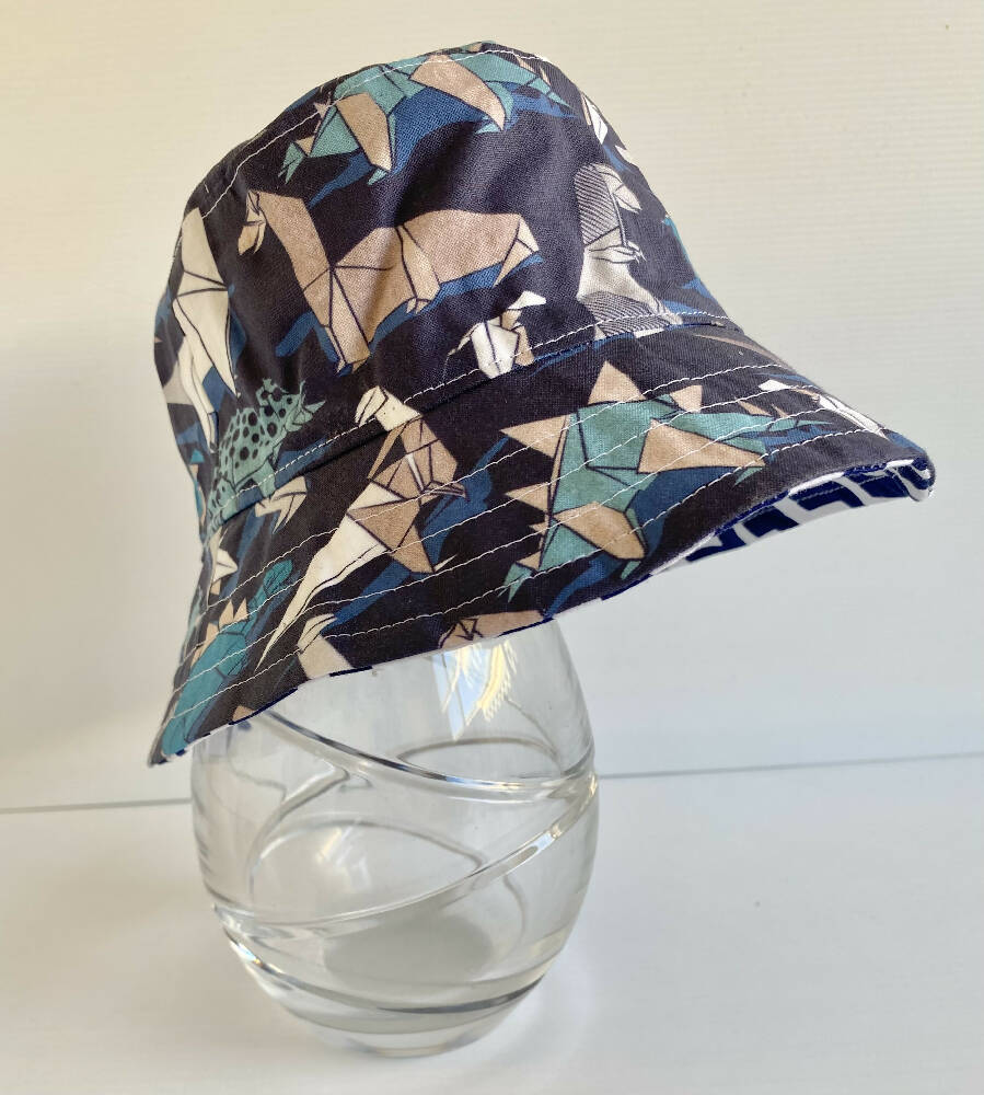 Summer hat in origami dinosaur fabric