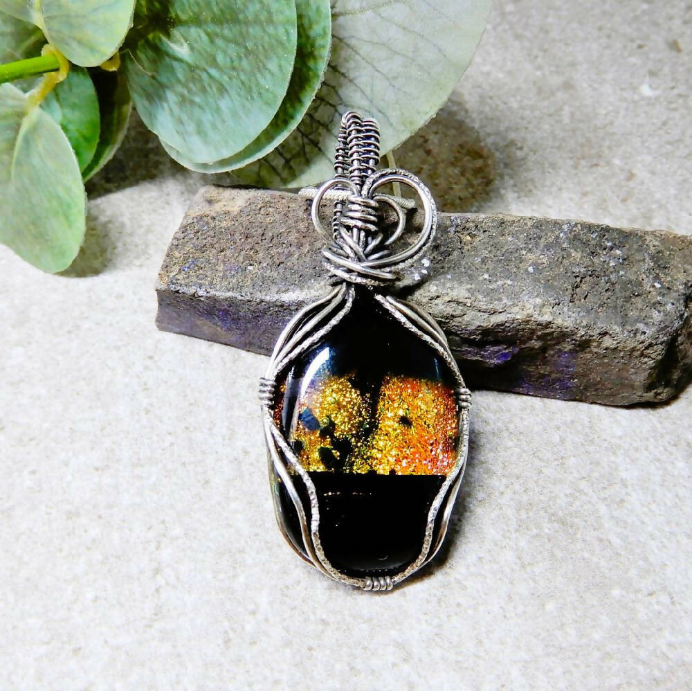 Dichroic glass pendant oxidised Sterling silver wrapped