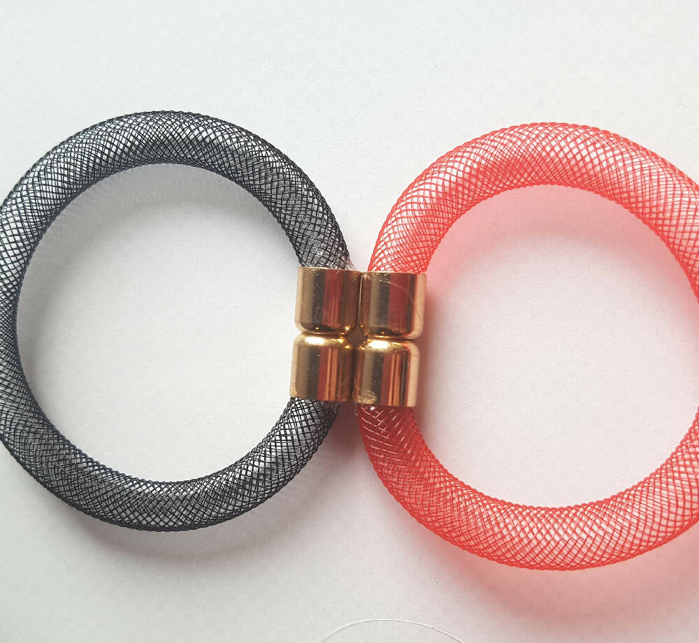 Bangle style bracelet. Red or black nylon mesh tubing