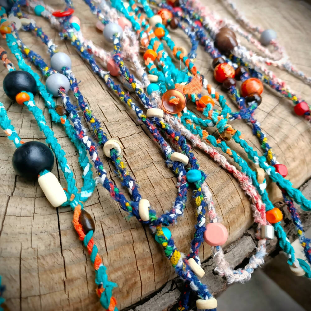 assorted handmade fabric necklaces recycled close up -