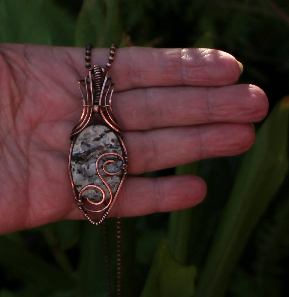Raw Astrophyllite in Copper with chain