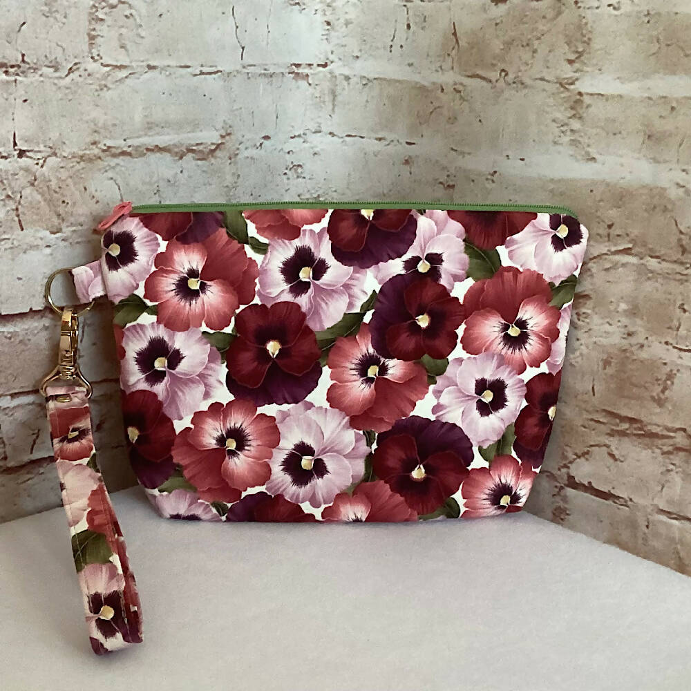 Pink Floral Pansies clutch purse with detachable wristlet. (Approx. 24cm x 17cm - 5cm gusset)