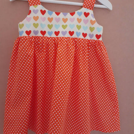 Cute size 3 child's dresses. One-Of-A-Kind Print Bodice with Contrasting Spots. Available in 2 colours.