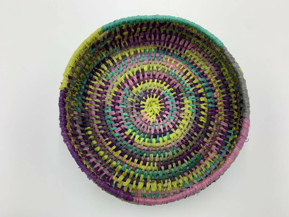 Basket in lime green, blue and purples shades of raffia