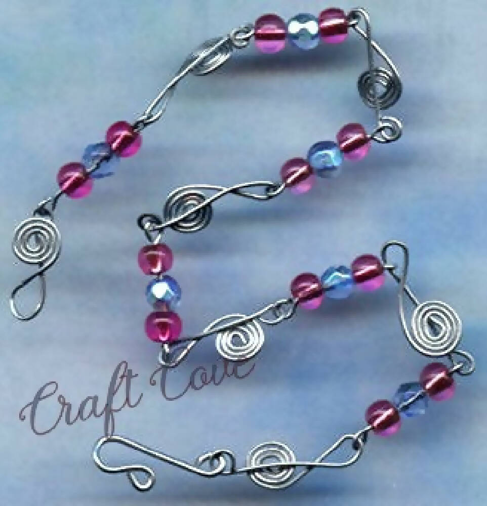 Bracelet wire worked with music shapes and beads