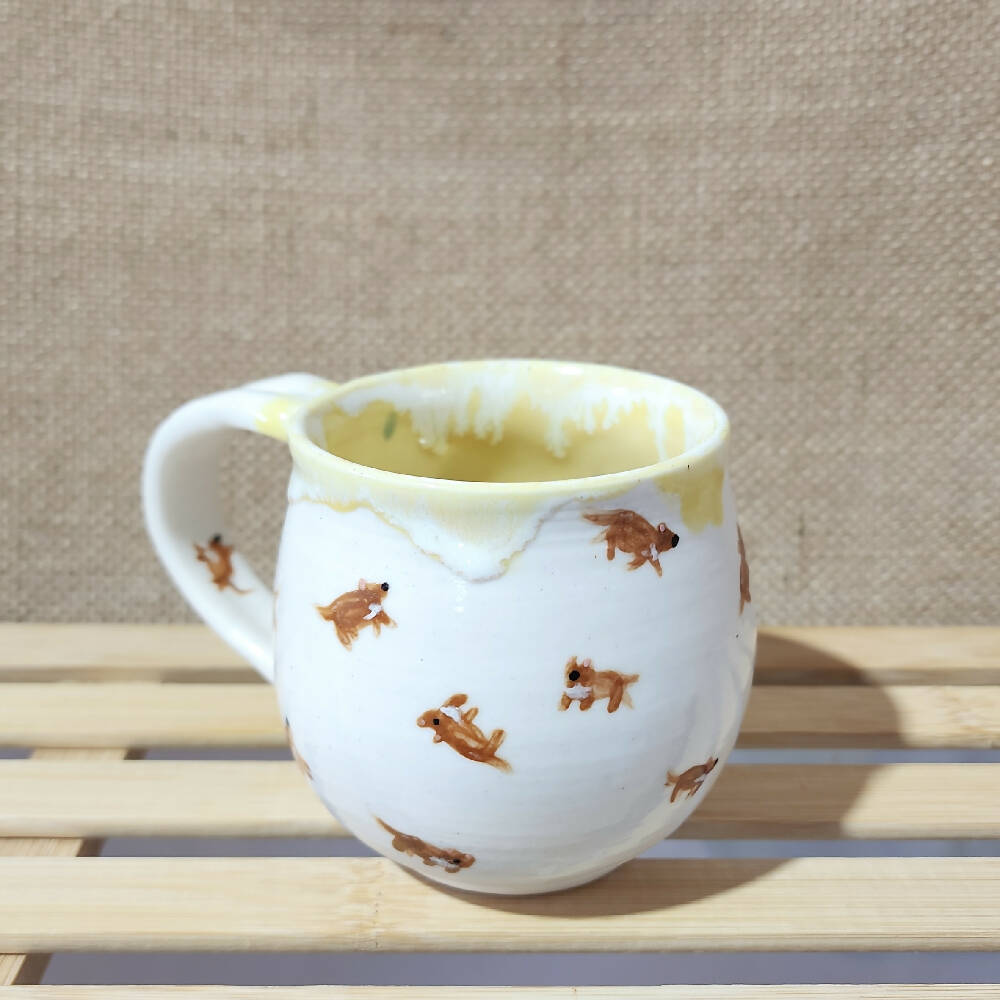 lemon yellow glazed porcelain tassie devil doodle mug, handmade in tassie