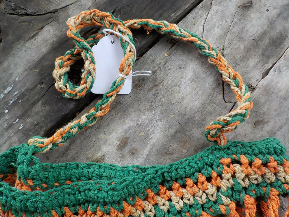 crocheted shopping carry string bag made from green, orange and beige cotton