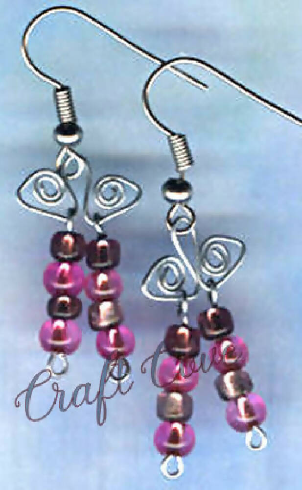Earrings wire worked in Squiggly shapes with beads
